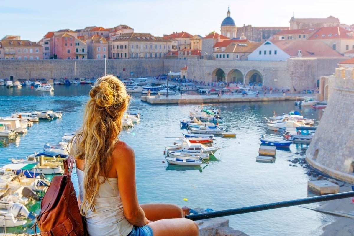 Young Woman Admiring A View Of Dubrovnik, Croatia